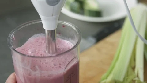 Young cook in uniform preparing smoothie Stock Footage 74509562