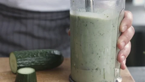 Young cook in uniform preparing vegetable smoothie 스톡 동영상 74507473