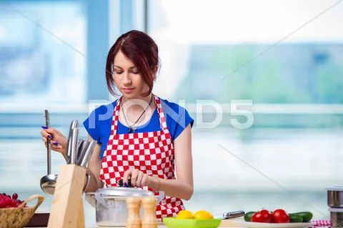 Young Cook Working In The Kitchen