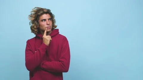 Young cool australian man looking sideways with doubtful and skeptical Stock Footage 139577298