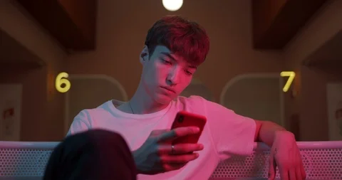Young Cool Millenial Guy Using his Modern Smartphone. Man Typing Message while Stock Footage 120122019