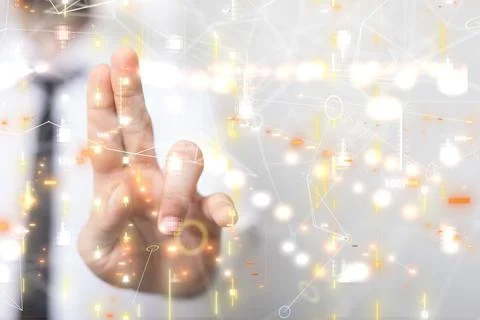 Young corporate executive gesturing at the computer screen with a data code with Stock Photos