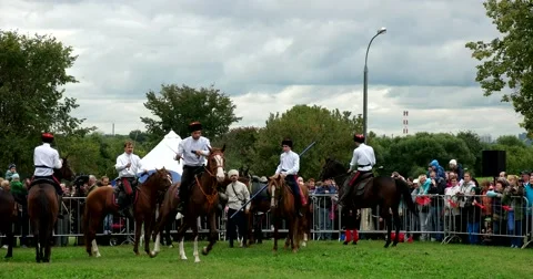 Young Cossacks perform elements of trick riding on horses Stock Footage 66186164