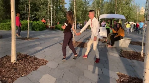 Young couople dancing in Zaradye park in summer Stock Footage 147328862