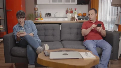 Young couple always spending time on their mobile phones. Stock Footage 148256706