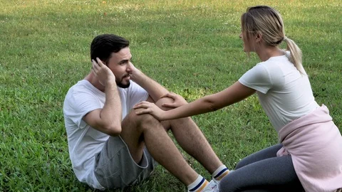 Young Couple are exercising in a park. Abdominal exercises Sit ups. sport, Stock Footage 101995873