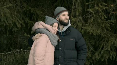 Young couple are sitting in the forest and talking Stock Footage 123525558