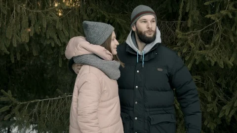 Young couple are sitting in the forest and talking Stock Footage 123527811