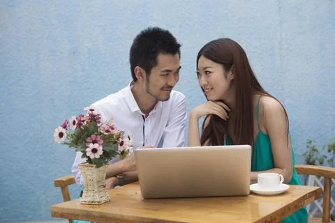 A young couple are using a computer Stock Photos