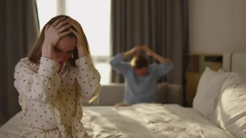 Young couple arguing in bedroom during tense relationship conflict, angry woman Stock Footage 337120635