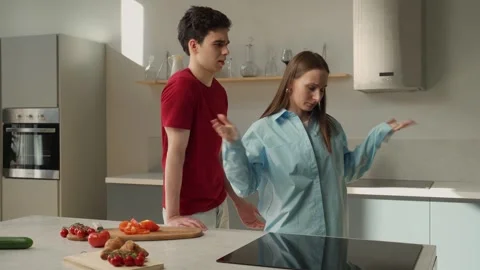 Young Couple Arguing in Modern Kitchen During Dinner Preparation at Evening Stock Footage 274551529