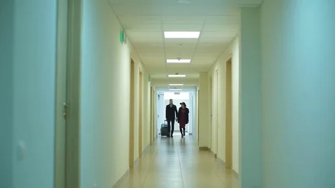 A young couple arrive at the hotel Stock Footage 73892638