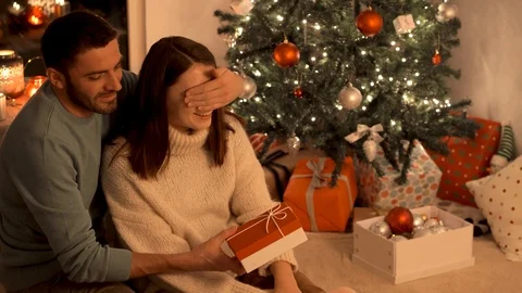 Young couple on the background of the Christmas tree . Stock Footage 120922833