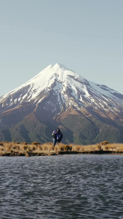 Young couple of backpackers embracing each other by lagoon with amazing vie.. Stock Footage 289105096