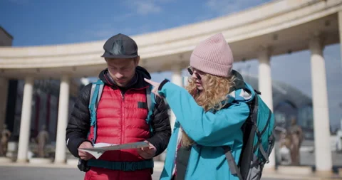 Young Couple Backpackers Looking at Map, Planning Route, Travel and Tourism Stock Footage 344829858