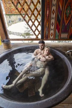 Young couple bathing in a vat Stock Photos