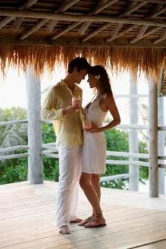Young couple at beach bar Stock Photos