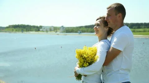 Young couple on the beach Stock Footage 11128533