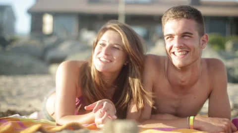 Young Couple on the Beach Stock Footage 24772724