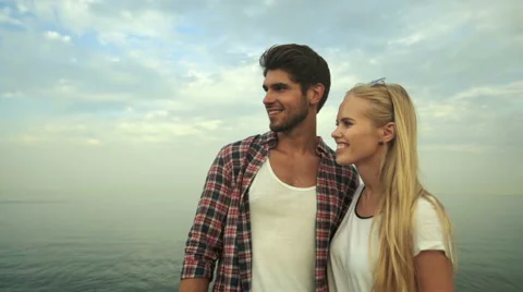 Young couple on the beach Stock Footage 68800348