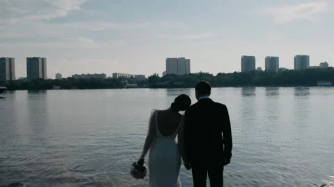 Young couple on the beach hugging each other Stock Footage 243420960
