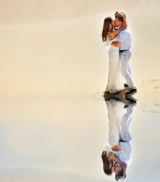 Young couple at the beach Stock Photos