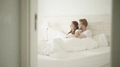 Young couple in bed Stock Footage 62685347