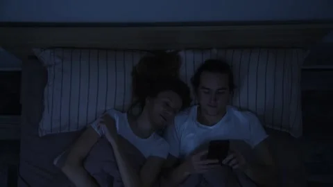 Young couple in bed. Video stock 147104398