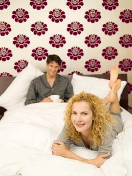 Young couple in bed Stock Photos