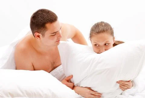 Young couple in bed Stock Photos