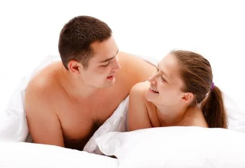 Young couple in bed Stock Photos