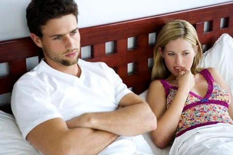 Young couple in bed Stock Photos