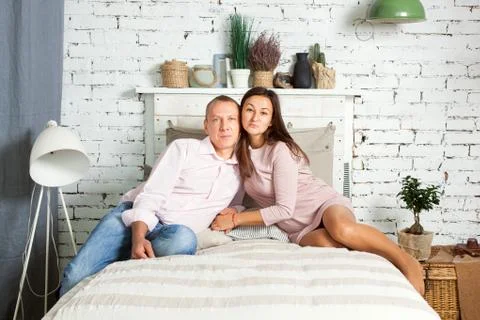 Young couple on the bed. 스톡 사진
