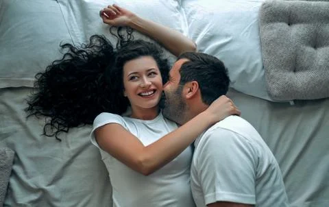 Young couple in bed Stock Photos