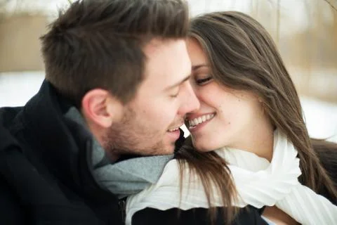 Young couple being affectionate in winter Stock Photos