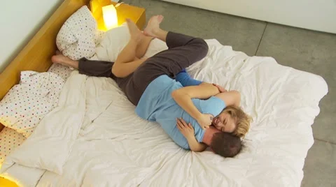 Young couple being romantic in bed Stock-Footage 7729969