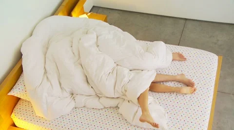 Young couple being romantic under covers Stock-Footage 7729960