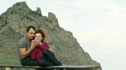 Young couple on a bench Stock Footage 805834