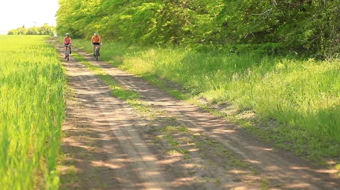 Young couple on bicycles Stock Footage 52687728