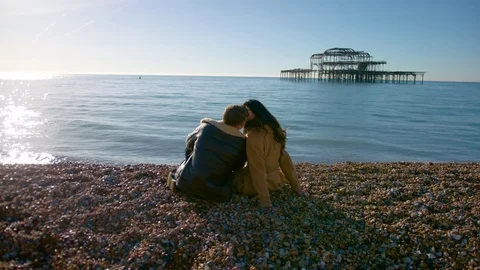 Young couple on brighton beach Stock Footage 84891943