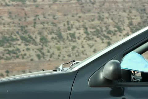 Young couple in the car showing something on the map 스톡 동영상 10793357