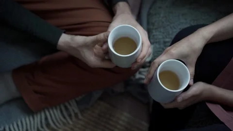 A young couple chatting cheerfully by the window next to the Christmas green Video stock 118538450