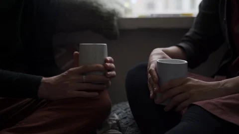 A young couple chatting cheerfully by the window next to the Christmas green Stock Footage 118538637