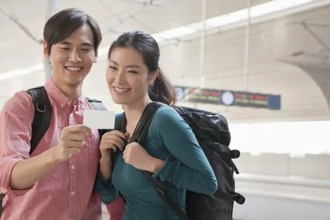 Young Couple Checking Their Train Ticket Stock Photos