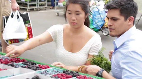 Young Couple Choosing Berries at Local Farmers Market Stock Footage 27780376