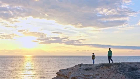 Young couple on a cliff Stock Footage 75274459