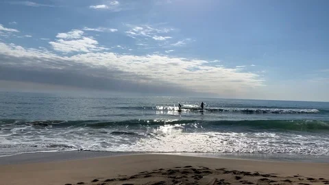 Young couple conquers the waves on the sup board Stock Footage 108511177