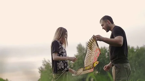 Young couple constructed a kite Stock-Footage 79606245
