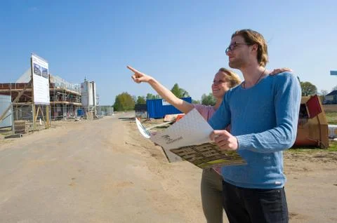 Young couple on construction site Foto stock