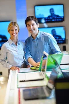Young couple in consumer electronics store Stock Photos